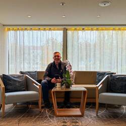 Mui grabbing a cup of coffee in one of the upper deck sitting nooks — Rinda.