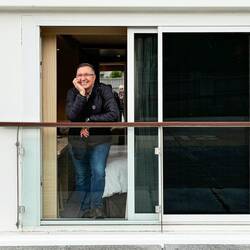 Mui posing on our French Balcony — Rinda.