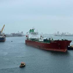 Small boats mark the ends of adjacent ships