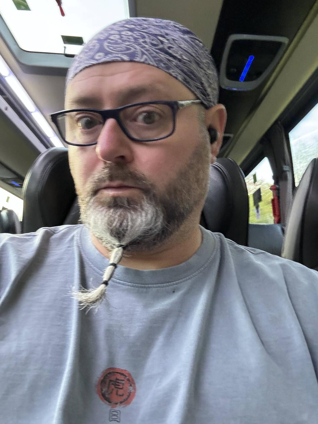 Looking somehow stunned to be on the coach...