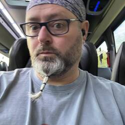 Looking somehow stunned to be on the coach...