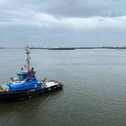 Tug positioning us at the Cruise Terminal
