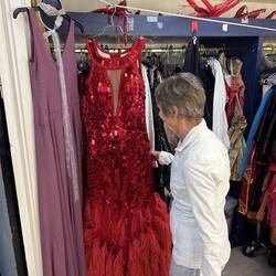 Lee admiring a dress that would be worn by the lead performer tonight.