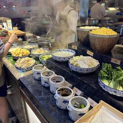 Several pictures showing extensive Asian breakfast choices.