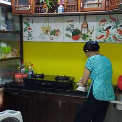 Quang's aunt preparing the home cooked dinner