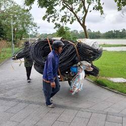 Hue; walking alongside the Perfume River downtown
