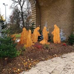 Nativity scene in wood under city arch