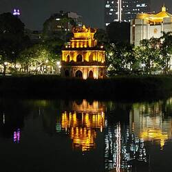 Hoan Kiem Lake; the Turtle Tower Pagoda (Thap Rua) has been erected on an islet