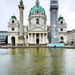 Karlskirche is a Baroque church commissioned in the 18th century — Vienna, Austria.