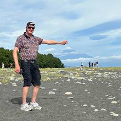 Don trying to pointing to the top of Mt Fuji, cloud covered. Rarely seen clearly.