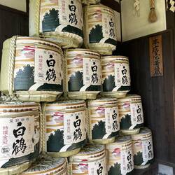 Depiction of Sake barrels securely wrapped for shipping