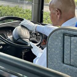 Most bus and taxi drivers wore white gloves.