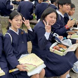 Friendly school children having lunch on their tour.