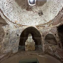 The top 'light' is a grated hole in the floor of the church. The square glass surrounds the well