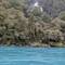 Blue water in the river everywhere with waterfalls in the background