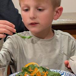 Blaise eating lots of veggies