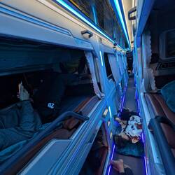 VIP sleeper Bus: Locals travelling and sleeping on the floor of the bus.