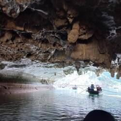 Coconut boat ride through the Bright Cave