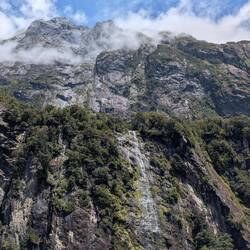 Vertical rock cliffs & waterfalls