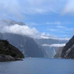 Boot on the water for perspective of how large Milford sound is