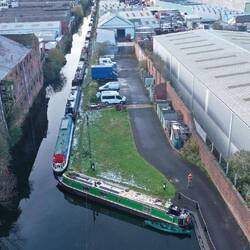 The long line of permanent moorings in a very industrial area