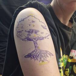 Charley converted the design into a stencil, printed it out and transferred it on to Vicky's arm