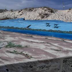 Mural on a slab of concrete on the beach here on Robertson Island