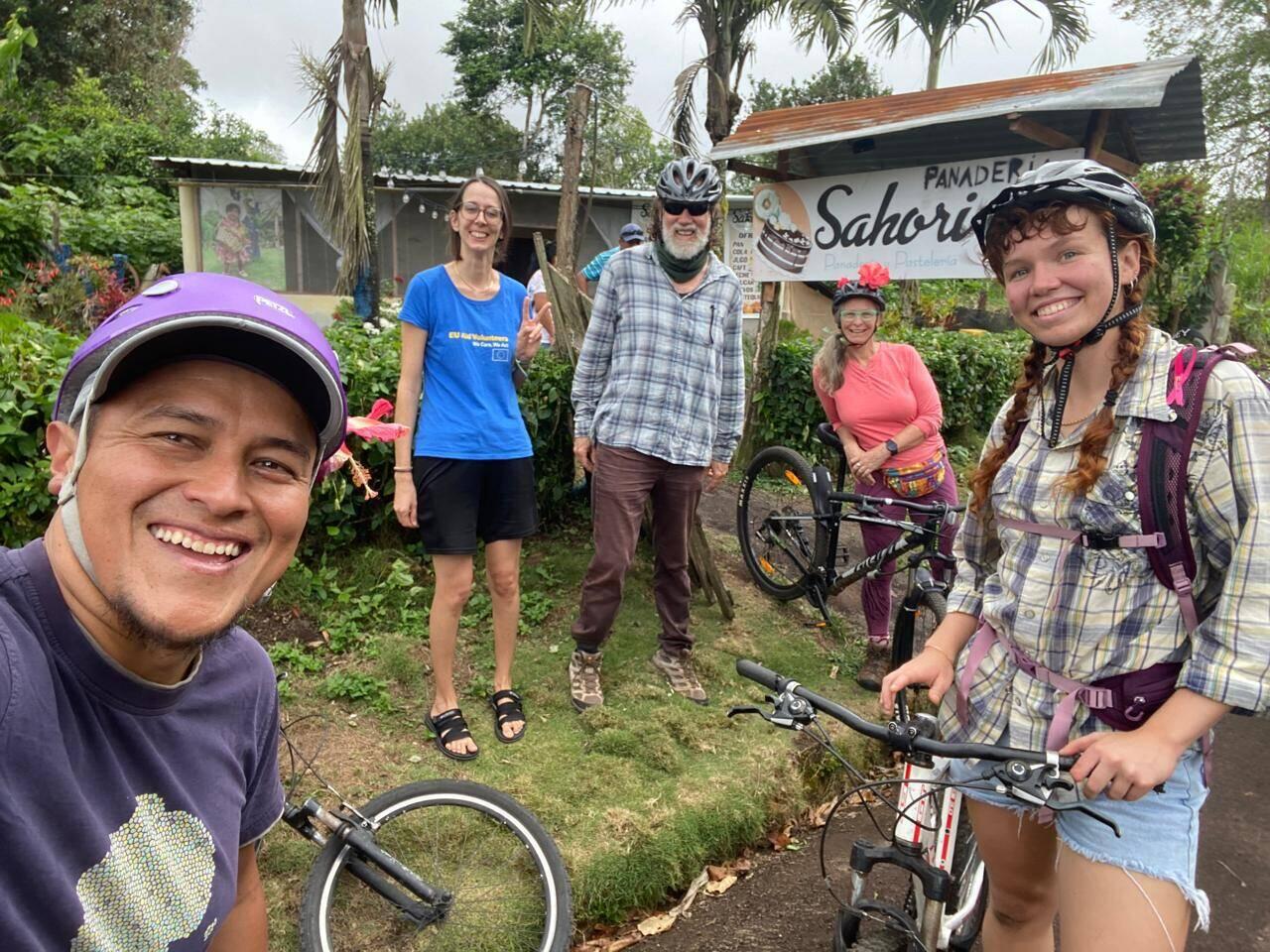 2nd bakery visit after getting lost and cycling back uphill; with Mariana who works with Jose