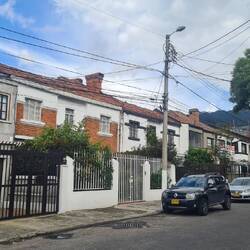 Here's a street of English brick cottages with front gardens