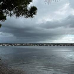 White salt hills lining the shore of the mainland