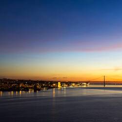 Sailing up the Tagus River at sunrise — Lisbon, Portugal.
