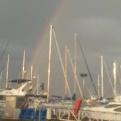 Pouring rain and rainbows at the Napier Marina