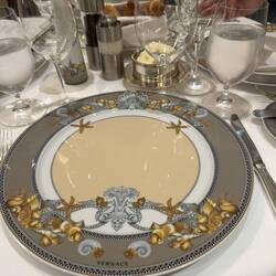 Custom made, Versace server plates, a different colour and design for each restaurant.
