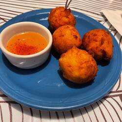 Mango vegan donuts with peach coulis