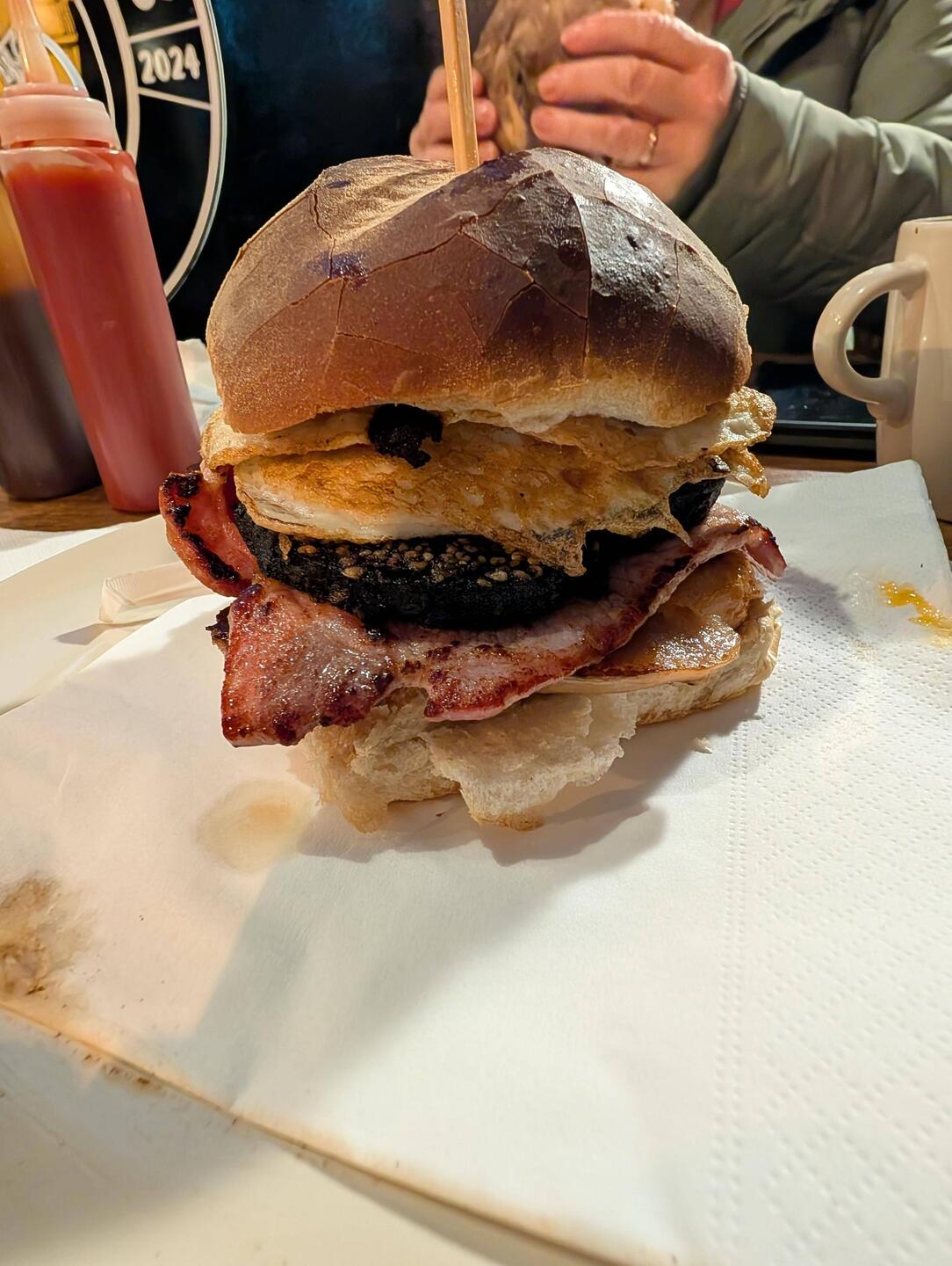 A full breakfast in a Bap - 2 Sausage, bacon, 2 black pudding and 2 eggs