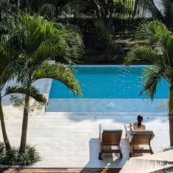 The femme fatale taking a morning dip in the infinity pool
