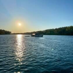 MB anchored off boat ramp.