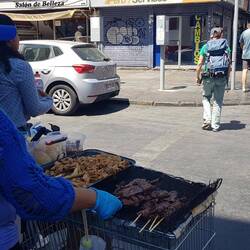Creative ways to earn a living: Mobile barbecue, improvised on a supermarket trolley.