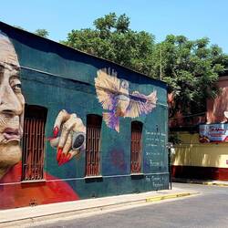 A lot of old buildings are adorned with graffiti.