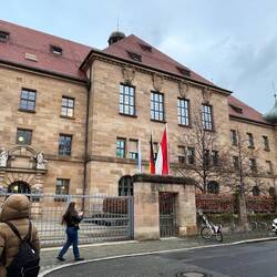Courtroom 600 is behind the top middle windows with the chandeliers (removed for the actual trial)