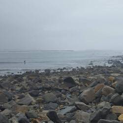 Surfers in the background