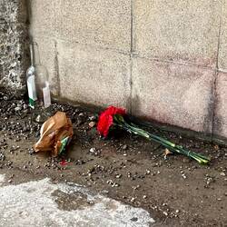 A tribute outside the gate. On arrival there was only the flowers.