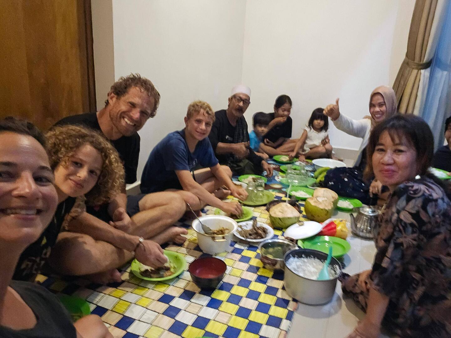 Dinner with our homestay family. Whole squid, spicy chicken, tempe +, all eaten with hands!