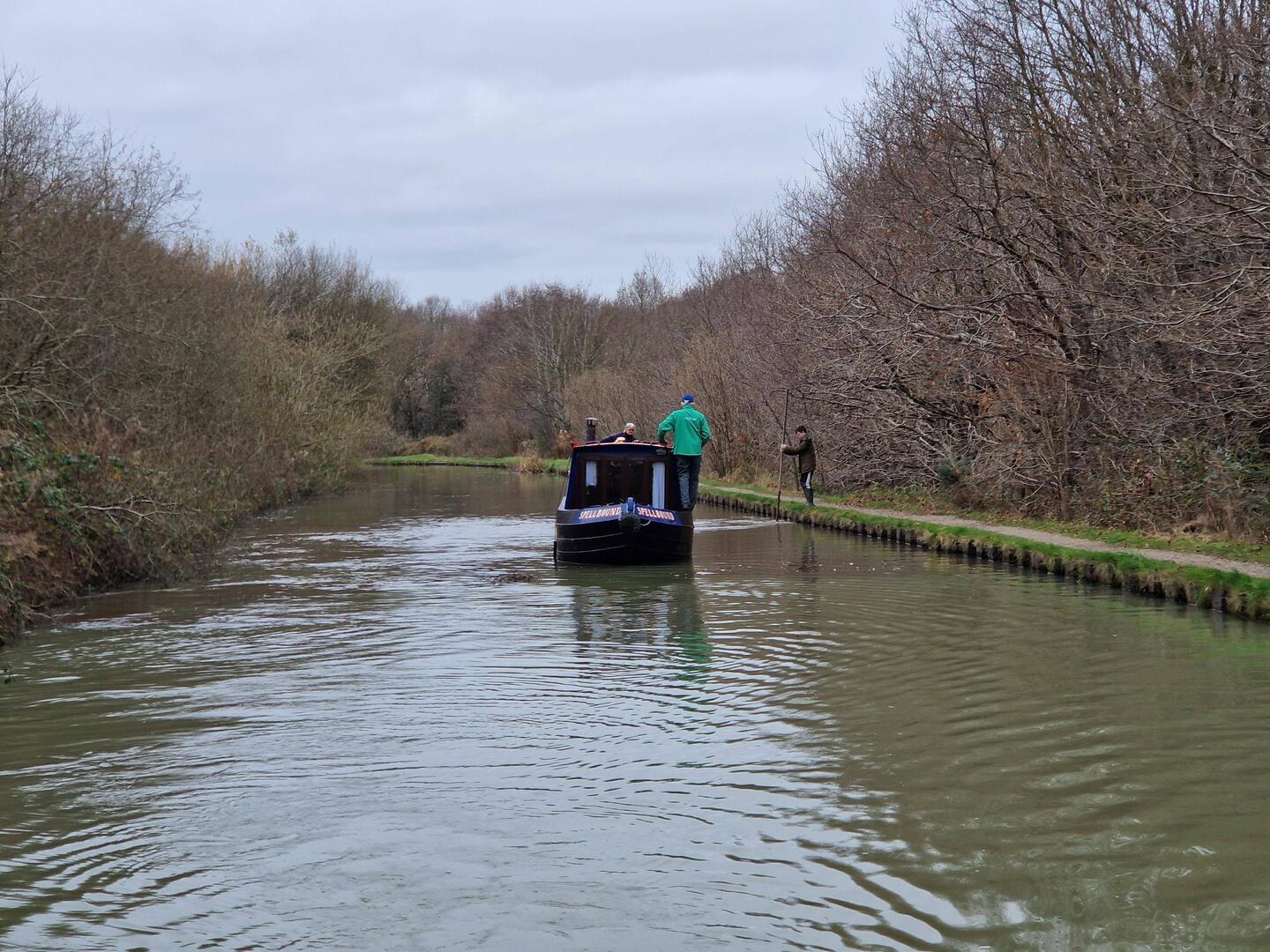 This boat was grounded badly against the towpath. We tied it to Rainboat and pulled it free.