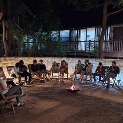 The fire is purely for effect, it's still around 25 degrees at this time in the evening.