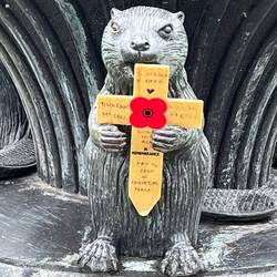 The flag poles at the entrance had beavers. Someone left a memorial