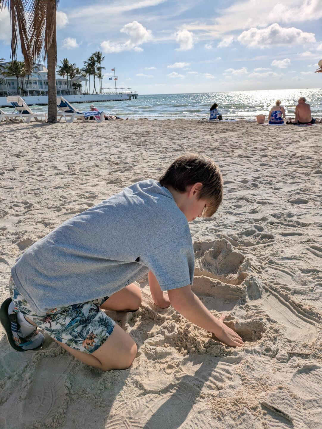 Holden building a throne room sand castle while we waited for coffee.