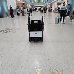 Autonomous wheelchair cruising through the terminal at MIA
