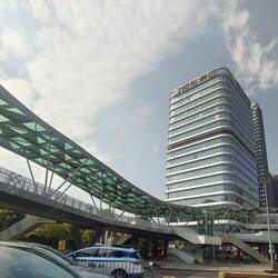 Overhead pedestrian/cycle way covered with glass roof