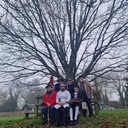 The group in front of the Mummers Tree in Stonleigh Community Orchard